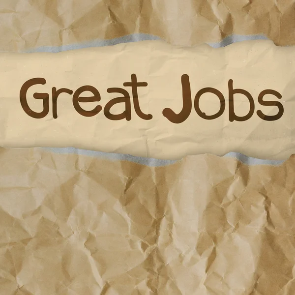 Hand trekt grote banen woorden op verfrommeld papier — Stockfoto