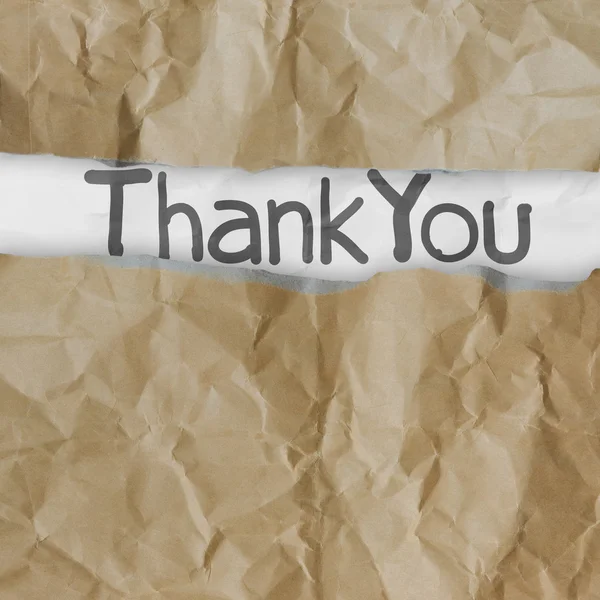 Hand drawn thank you words on crumpled paper with tear envelope — Stock Photo, Image