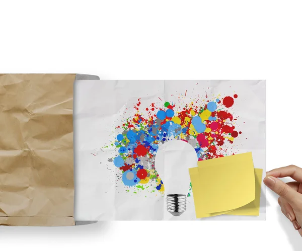 Blank sticky note with splash colors lightbulb crumpled envelope — Stock Photo, Image