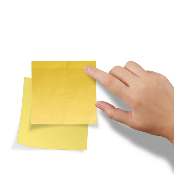 Hand touch blank yellow sticky note — Stock Photo, Image