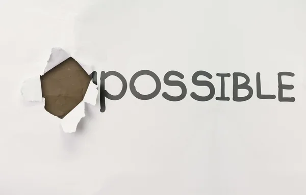 Crumpled paper through word impossible transformed into possible — Stock Photo, Image