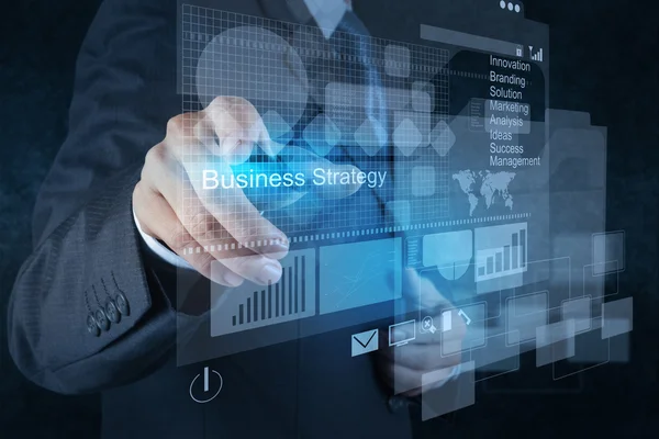 Businessman hand points to business strategy — Stock Photo, Image