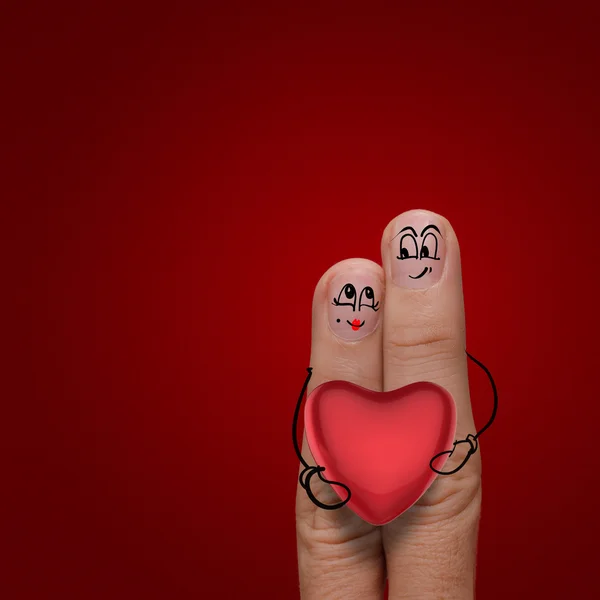 The happy finger couple in love with painted smiley Stock Image