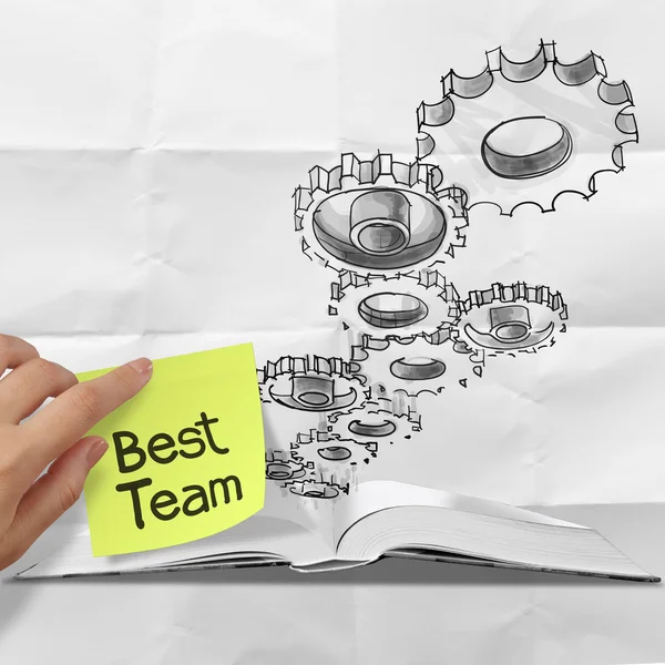 Hand drawn gear cog best team with sticky note on crumpled paper — Stock Photo, Image