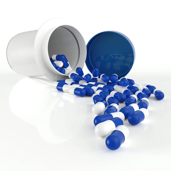Pilules renversant hors de la bouteille de pilule sur blanc — Photo