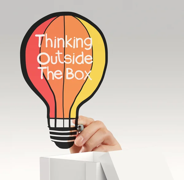 Hand drawing balloon lightbulb and thinking outside the box as c — Stock Photo, Image