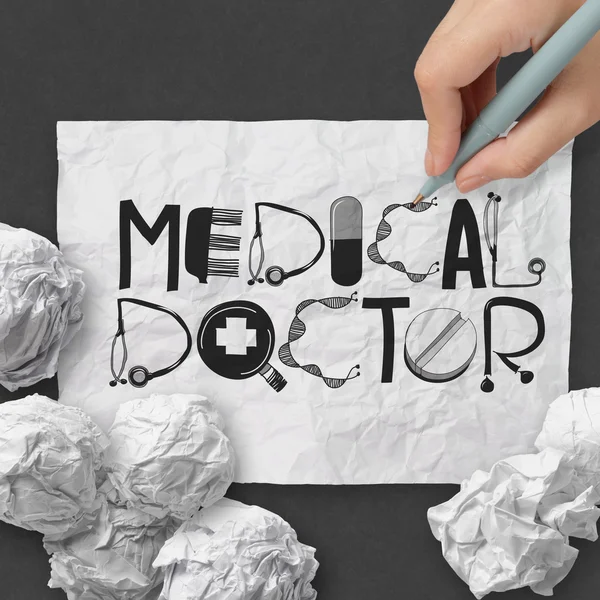 Hand drawn design word MEDICAL DOCTOR on crumpled paper with as — Stock Photo, Image