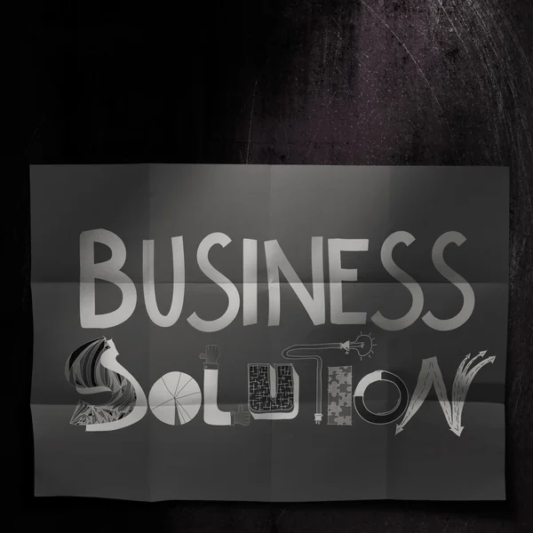 Design word BUSINESS SOLUTION on dark crumpled paper and texture — Stock Photo, Image