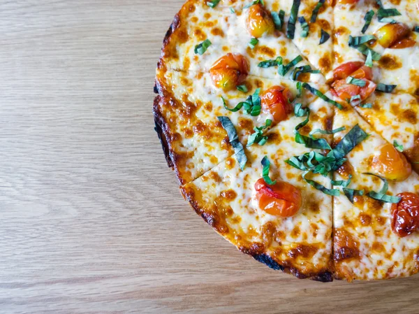 Delicious italian pizza on wood table — Stock Photo, Image