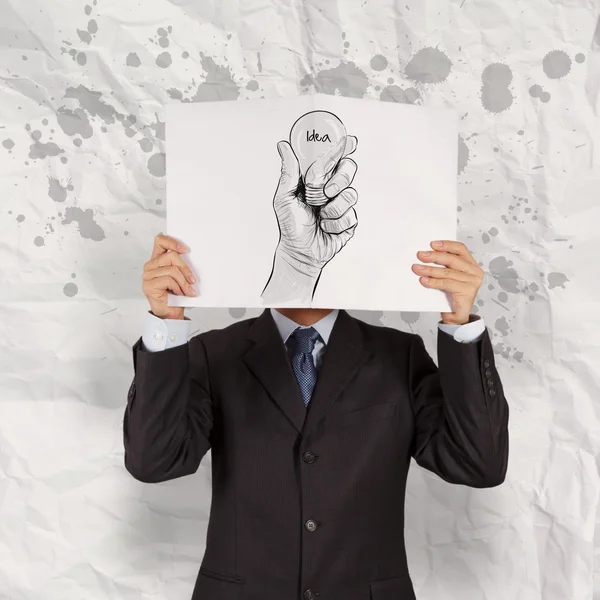 Hombre de negocios mostrar libro de mano bombilla dibujada con palabra IDEA en —  Fotos de Stock
