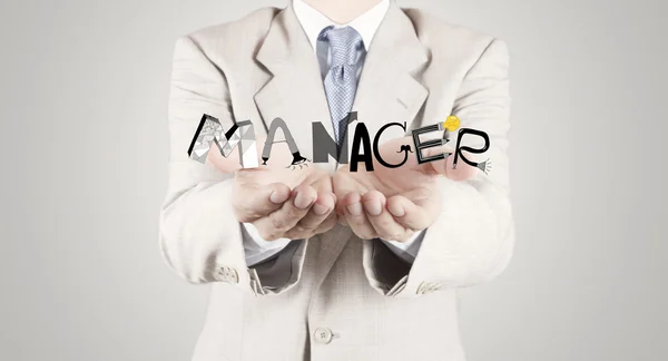 Businessman hand showing design graphic word MANAGER as concept — Stock Photo, Image