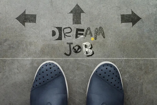 Hand drawn DREAM JOB design word on front of business man feet a — Stock Photo, Image