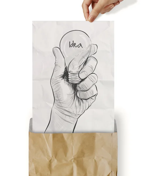 Hand drawn light bulb with IDEA word on crumpled paper as concep — Stock Photo, Image