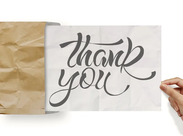 Üzletember kézzel design szó köszönöm mutat mint Összegyűrt papír — Stock Fotó