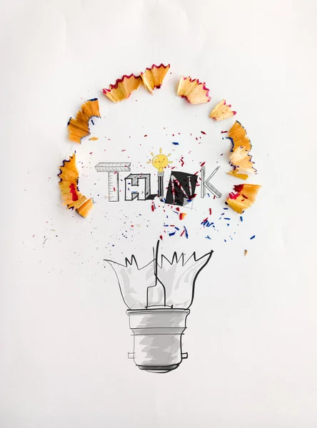 Hand drawn light bulb word design THINK with pencil saw dust on — Stock Photo, Image