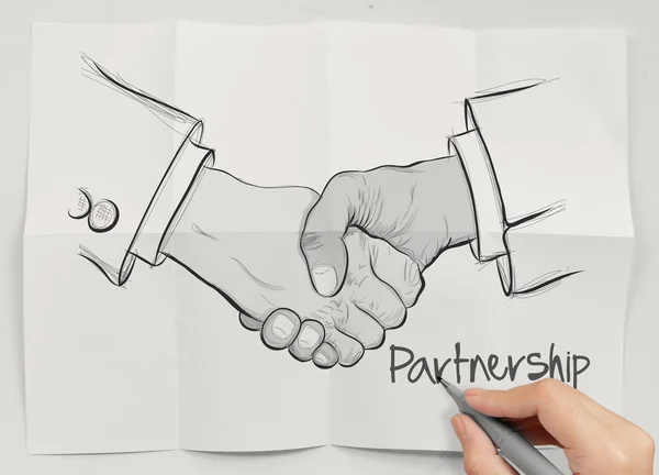 Hand dras handslag tecken som partnerskap affärsidé — Stockfoto