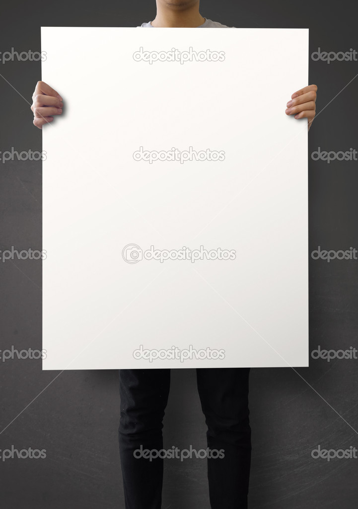 hipster holding blank poster on texture wall as concept 
