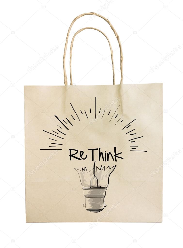 Hand drawn light bulb with RETHINK word paper recycle bag on whi