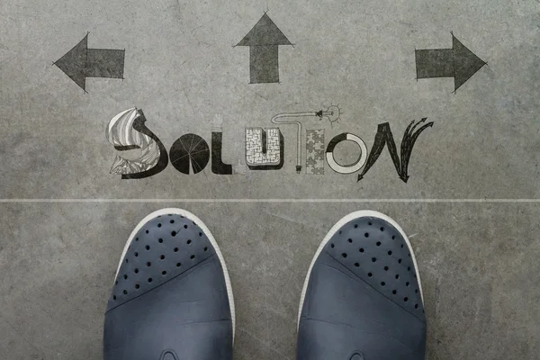 Hand drawn SOLUTION  design word on front of business man feet — Stock Photo, Image