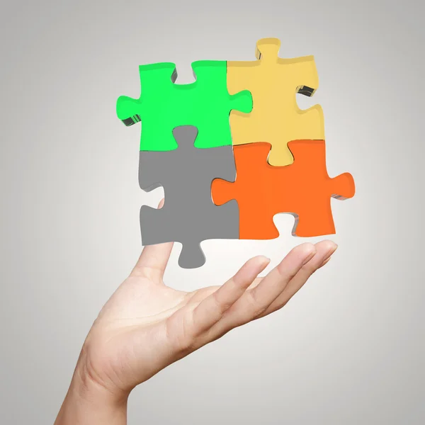 Hand showing 3d puzzle as concept — Stock Photo, Image