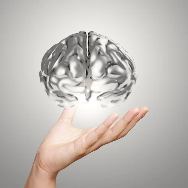 Podnikatel rukou ukazující 3d kovové lidský mozek jako koncept — Stock fotografie