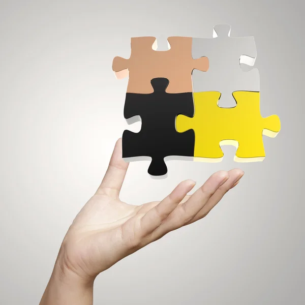 Hand showing 3d puzzle as concept — Stock Photo, Image