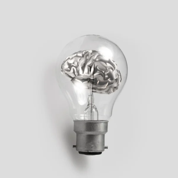 3d metal human brain in a lightbulb as creative concep — Stock Photo, Image