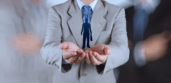 Business man hand choosing people icon as human resources concept — стоковое фото