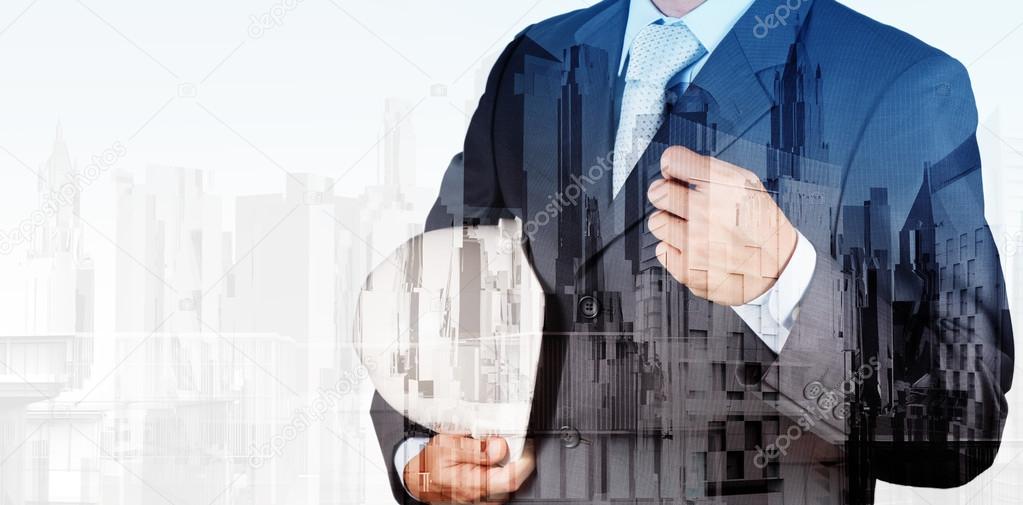Double exposure of business engineer and abstract city as concep