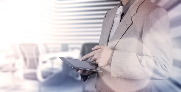 Businessman shows modern technology — Stock Photo, Image