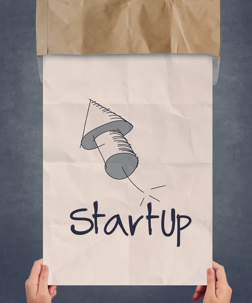 Businessman hand showing poster of start up icon as concept — Stock Photo, Image