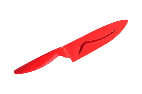 Красный керамический нож с ножницами — стоковое фото