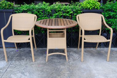 Out door rattans tables and chairs set. clipart