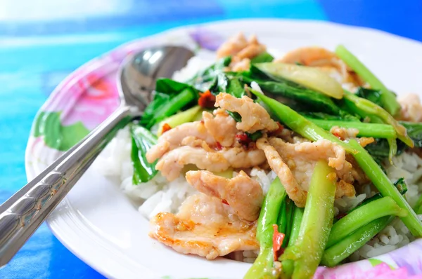 Kale vegetable with porky on rice. — Stock Photo, Image