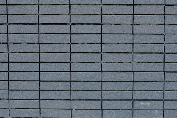 Quadratische Ziegelmauer — Stockfoto