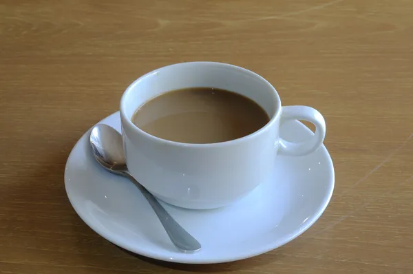Copo de café branco com colher — Fotografia de Stock