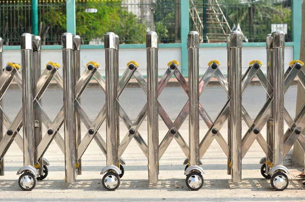 Iron sliding fence with wheel. — Stock Photo, Image