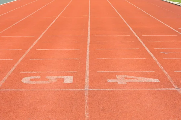 Números de corredores em pista de corrida . — Fotografia de Stock