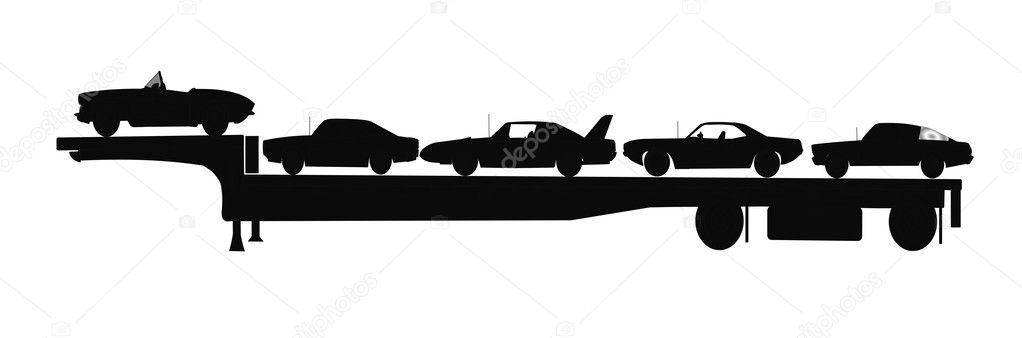 Cars on trailer in silhouette