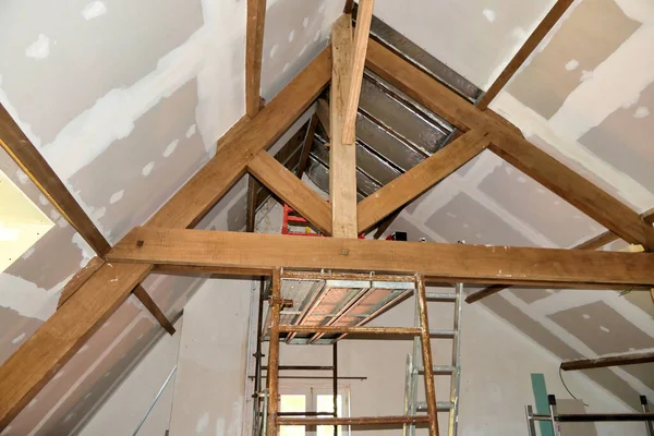 Plasterboard Fitted New Roof Insulation Highlighting Exposed Beams Trusses — Zdjęcie stockowe