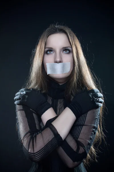 Pretty gothic girl in corset with sealed mouth — Stock Photo, Image