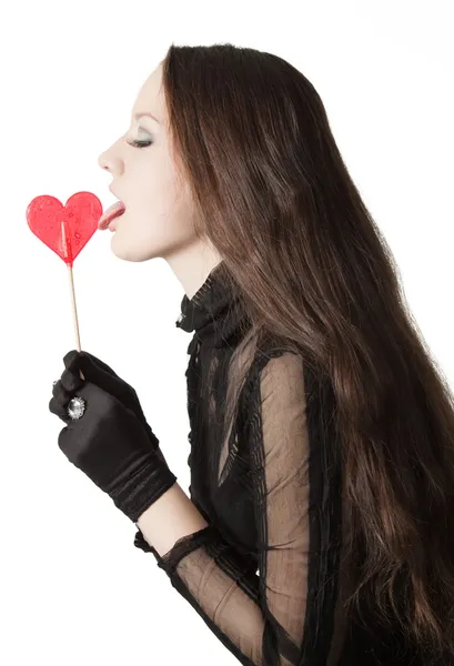 Pretty girl licking lollipop — Stock Photo, Image