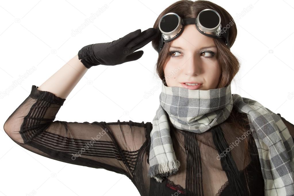 Prety pilot in scarf saluting over white