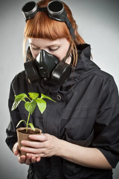Redhead girl with plant — Stock Photo, Image