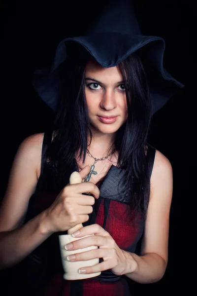 Witch with mortar and pestle — Stock Photo, Image