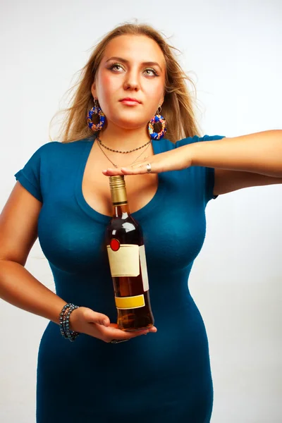 Sexy woman with bottle of rum — Stock Photo, Image