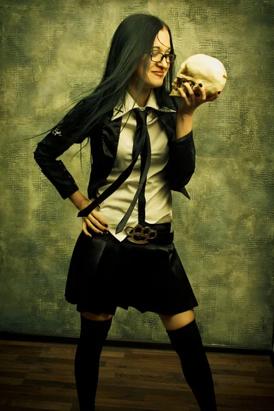 Sexy student with skull — Stock Photo, Image