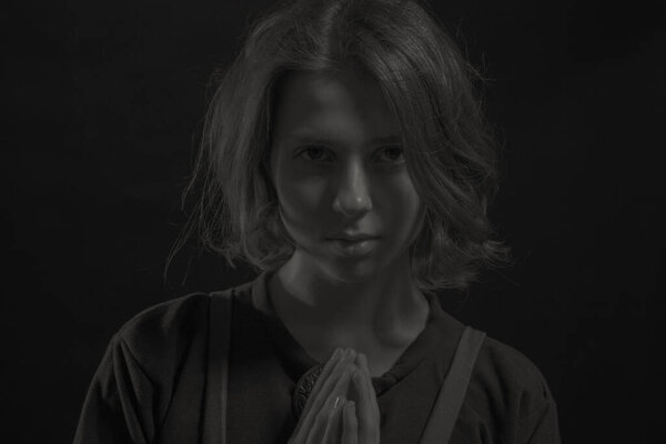 Pretty medieval scandinavian woman posing over dark background.