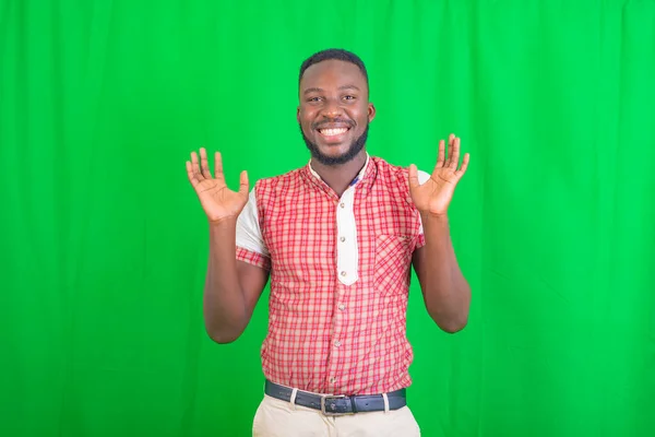 Portrait Happy Handsome Young Man Standing Green Background Showing Both — Stock Photo, Image