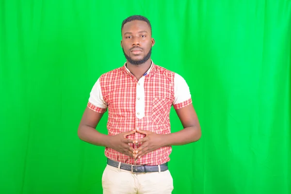 Portrait Serious Handsome Young Man Standing Green Background While Looking — Stock Photo, Image